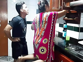 Diana Prince tries to satisfy her son with her beaver in the kitchen