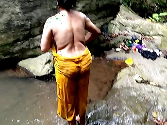 Ashok together with Surwana Kumari take loopings pissing in public while bathing in a pond in the woods