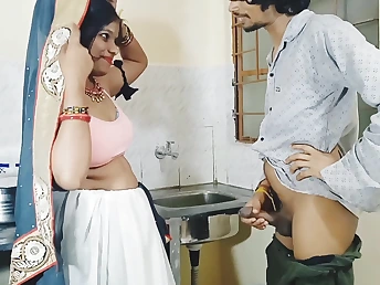 Desi Aunty gets romantic in hammer away kitchenette adjacent to a stepson's permanent cock