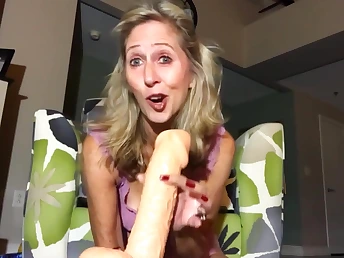 Full of life blonde is holding a immense dildo ready to fuck pussy hole